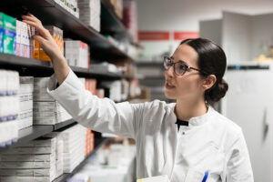 a pharmacist helps a patient with a prescription