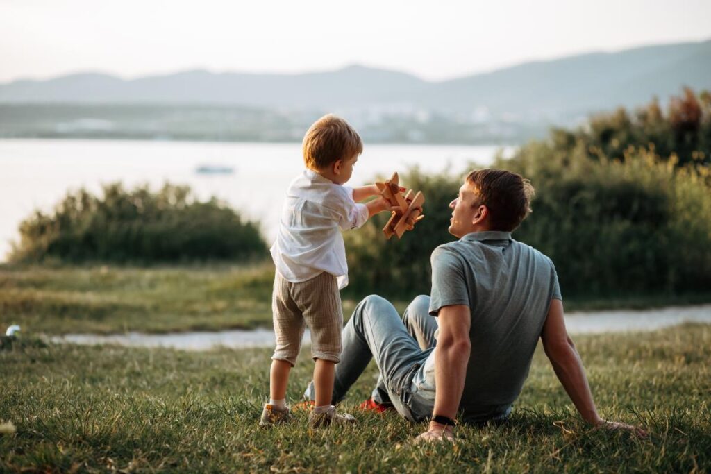 a father and child spend quality time together in a field