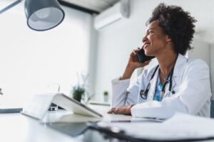 a doctor answers questions for a patient over the phone