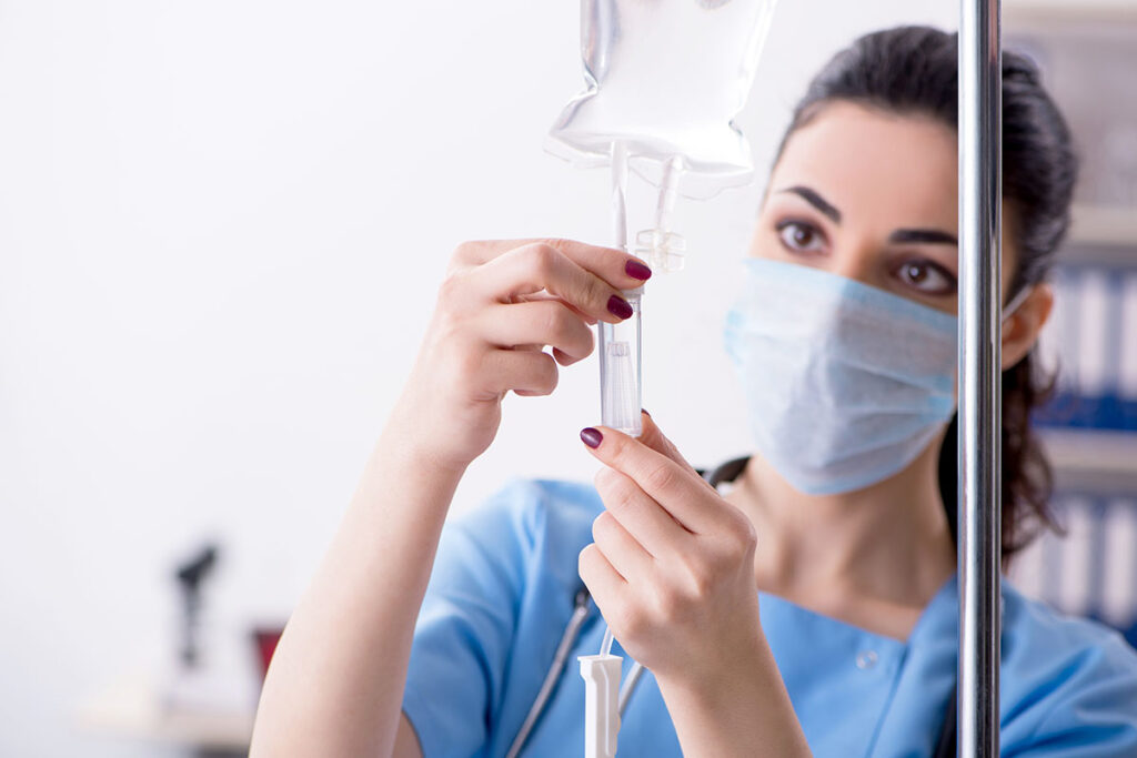 a nurse prepares an iv