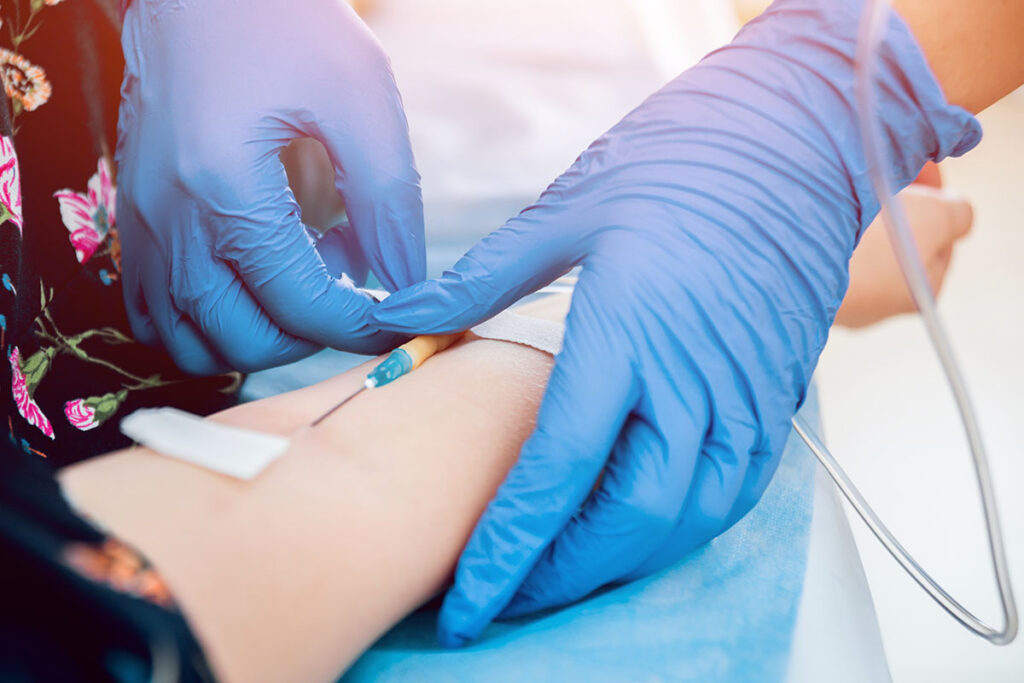 a nurse makes starts a patient on iv therapy