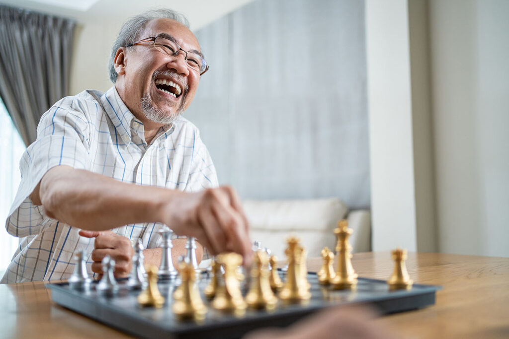 an older man wins a game of chess