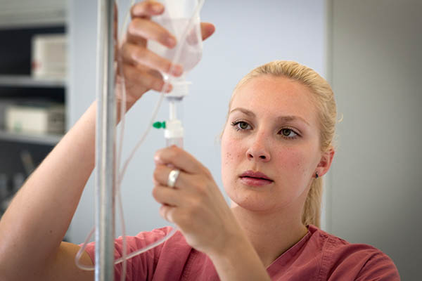 Nurse checking iv